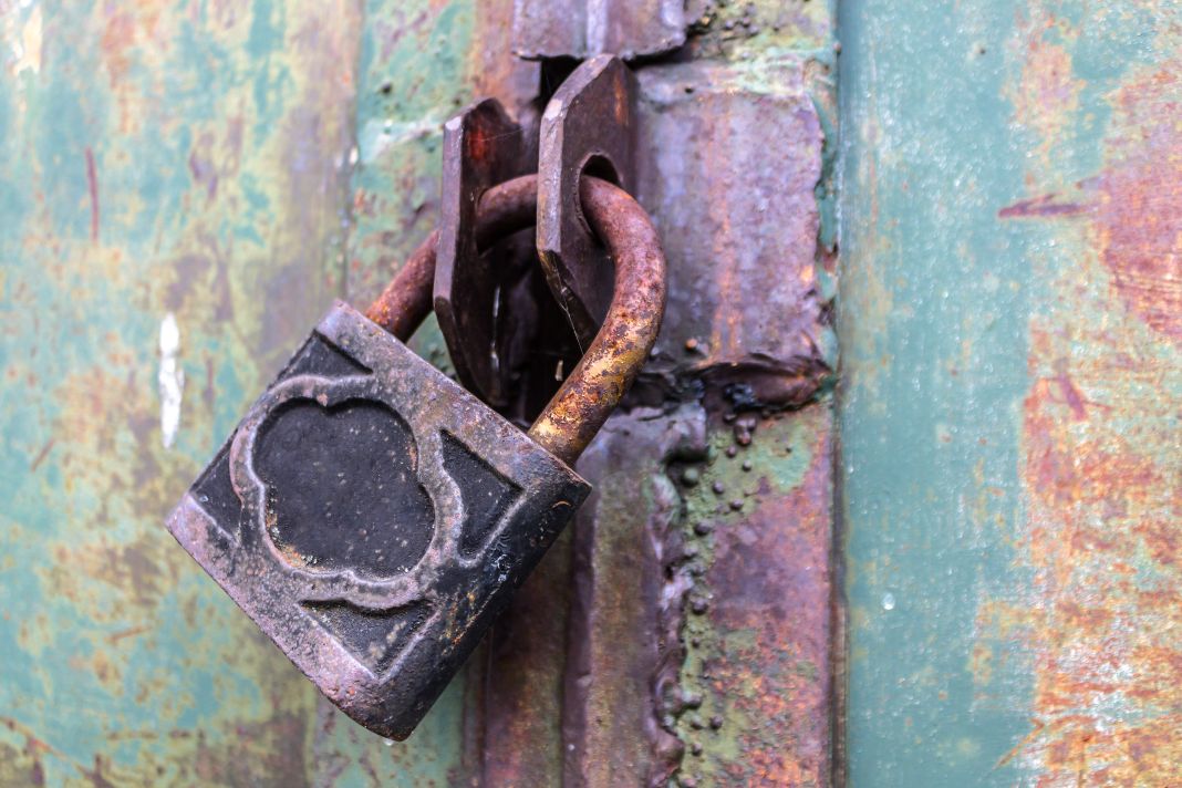 old-and-rusty-padlock-with-scratches-locks-the-ste-2022